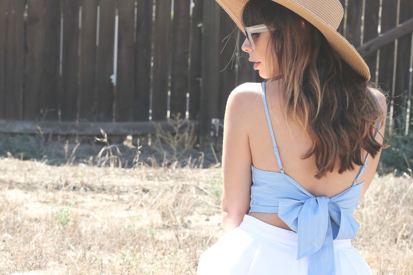 Stiletto Beats, los angeles blogger, field photoshoot, Los Angeles, shop akira, akira, white shorts, bow back top, urban outfitters straw hat, celine sunglasses,