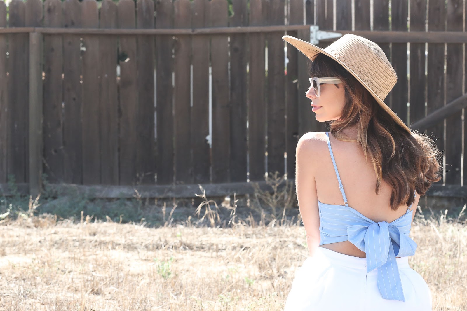Stiletto Beats, los angeles blogger, field photoshoot, Los Angeles, shop akira, akira, white shorts, bow back top, urban outfitters straw hat, celine sunglasses,