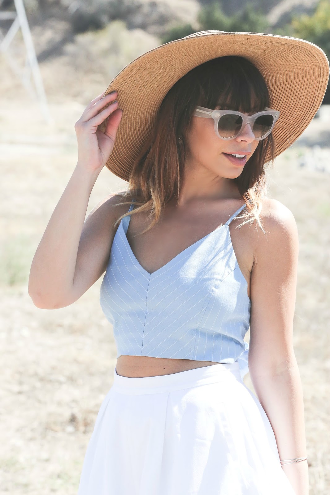 Stiletto Beats, los angeles blogger, field photoshoot, Los Angeles, shop akira, akira, white shorts, bow back top, urban outfitters straw hat, celine sunglasses,